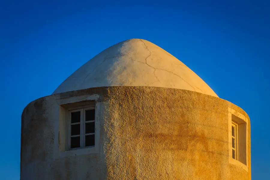 Picture of the roof of a windmill in Imerovigli at sunrise