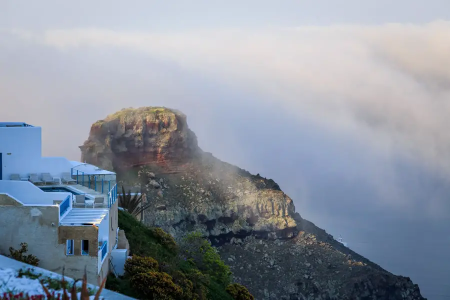 View of Skaros Rock as the clouds clear one morning in Santorini