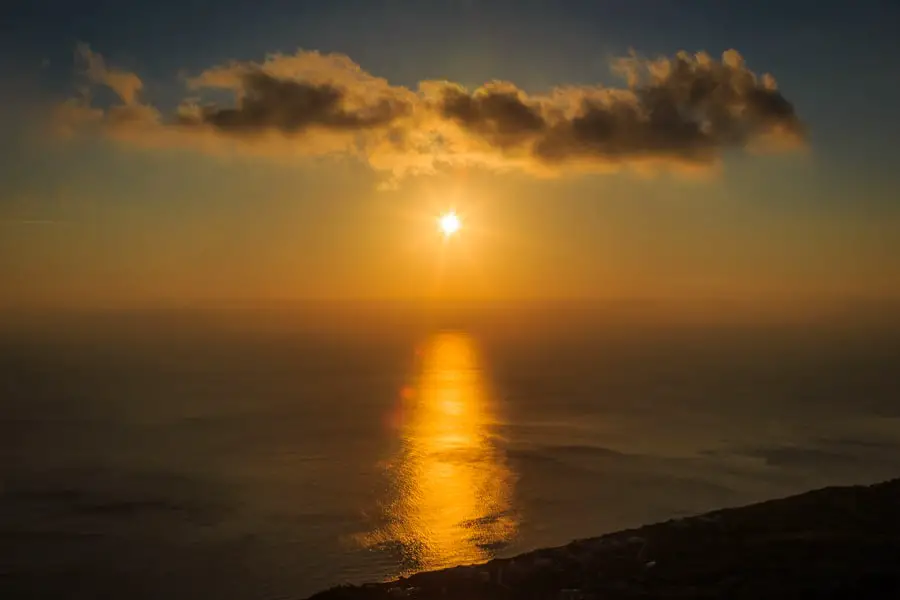 Stunning Santorini sunrise on the sea viewed from the top of the