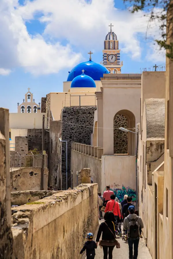 Tourists walking to the churches of Fira in Santorini